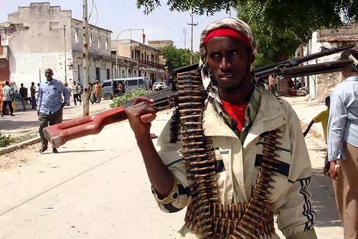 A Somalia Islamic Courts Union's security agent patrols the streets of Bermuda village in Wagberi district, central Mogadishu