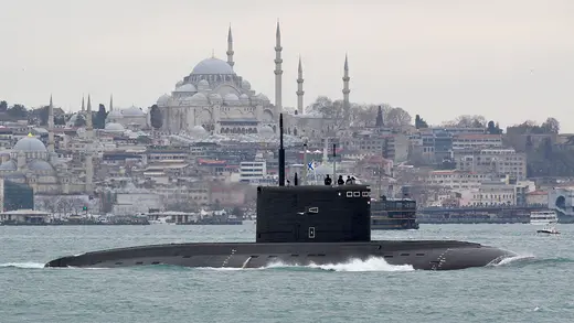 A Russian submarine surfaces in the Bosporus with Istanbul in the background