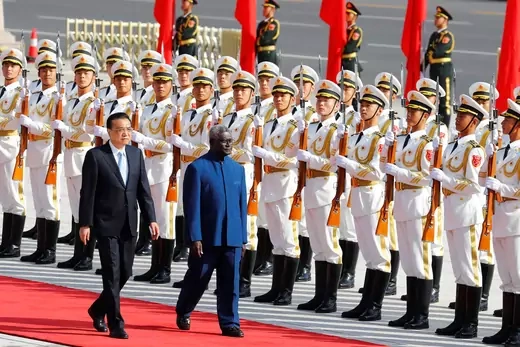 Solomon Islands Prime Minister Manasseh Sogavare reviews the honour guard during a welcome ceremony with Chinese Premier Li Keqiang outside the Great Hall of the People in Beijing
