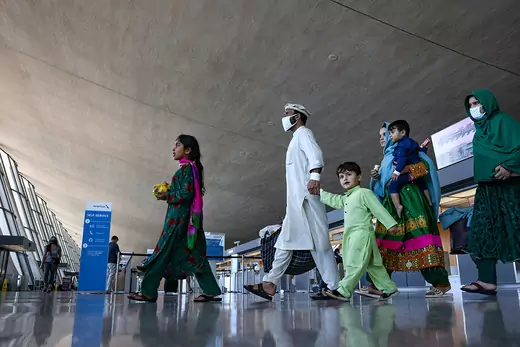 Afghan refugees walk through Dulles International Airport in Dulles, Virginia, on September 2, 2021.
