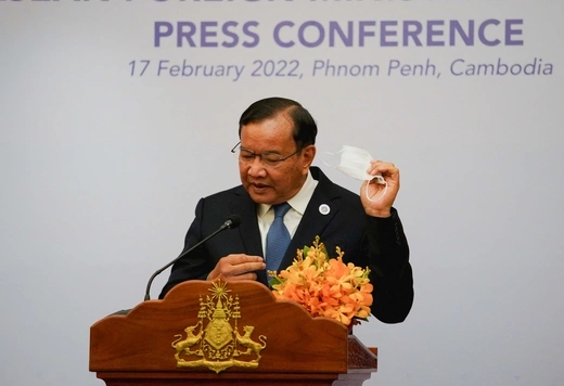 Cambodia's Foreign Minister Prak Sokhonn removes his mask before the news conference after the ASEAN foreign ministers' meeting in Phnom Penh, Cambodia, on February 17, 2022.