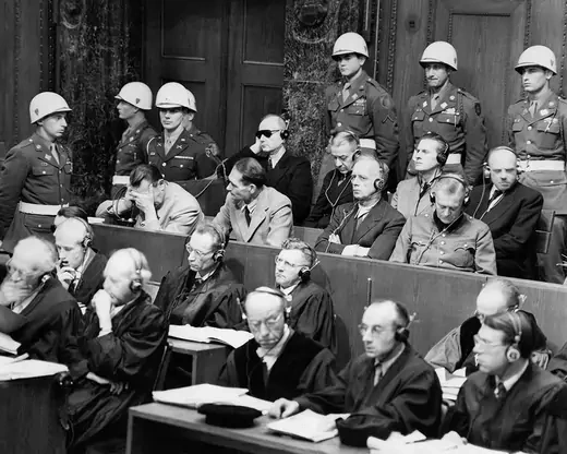 German war crimes defendants sitting in a courtroom of the International Tribunal. 