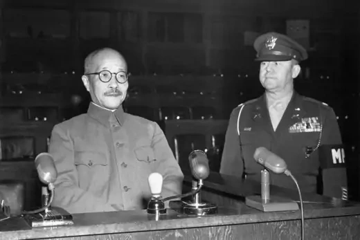 Former Japanese Prime Minister Tojo Hideki sits in witness chair next to Lt. Col. A.S. Kenworthy.