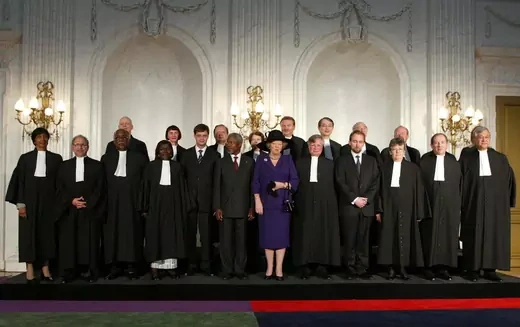 ICC judges pose with foreign dignitaries after the court’s inaugural ceremony.