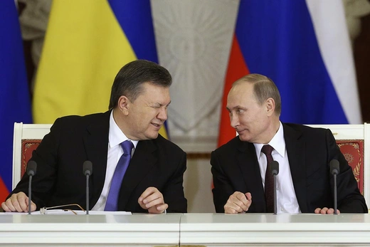 President Viktor Yanukovich winks at Russian President Vladimir Putin during a meeting in Moscow.