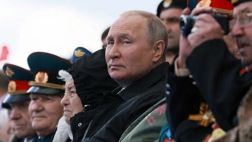 Russian President Vladimir Putin watches a military parade on Victory Day in central Moscow, Russia May 9, 2022.