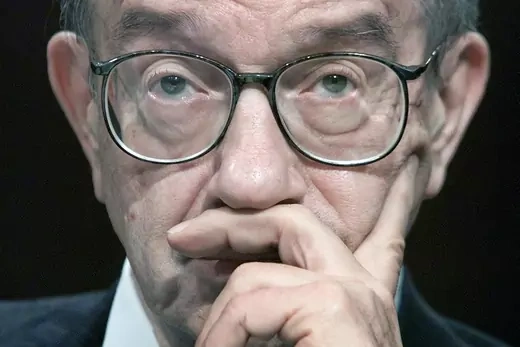 Closeup of Alan Greenspan's face. He is wearing glasses.