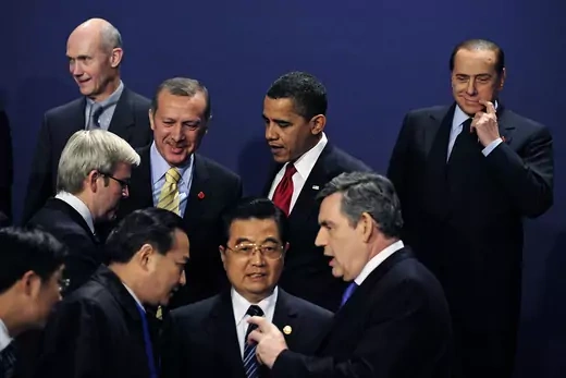 World leaders are seen preparing to pose for a group photo during a G20 summit.