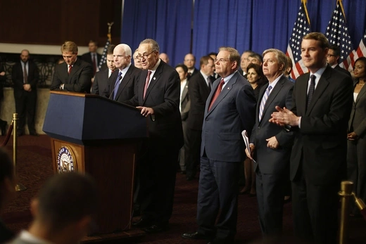 A bipartisan group of U.S. senators attend a press conference on a plan for immigration reform in 2013.