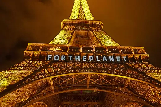 The Eiffel Tower is seen with the words 'For The Planet' displayed on it. 