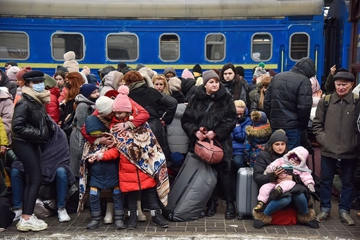 Refugees from Ukraine wait at Lviv railway station to board train to Pland.