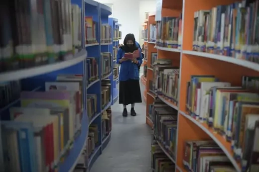 A woman reads at the Jakarta's Public Library in Jakarta, Indonesia, Oct. 27, 2021.