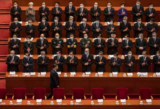 hinese President Xi Jinping, bottom left, is applauded by members of the government as he arrives at the opening session of the National Peoples Congress at the Great Hall of the People on March 5, 2022 in Beijing, China. China's annual political gathering known as the Two Sessions opened Friday and will convene leaders and lawmakers to set the government's agenda for domestic economic and social development for the year. 
