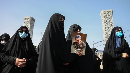 People attend the funeral of Colonel Hassan Sayyad Khodaei on May 24, 2022, in Tehran.