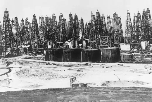 Oil derricks are seen in a section of the Spindletop Field in Beaumont, Texas.