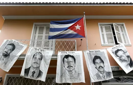 Posters with portraits of five Cubans jailed in the United States - Rene Gonzalez Sehwerert, Gerardo Hernandez Nordelo, Fernando Gonzalez Llort, Ramon Labanino Salazar and Antonio Guerrero Rodriguez - are dispayed in front of the Cuba's Consulate during a demonstration in support of Cuban revolution