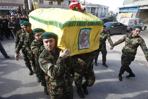 Lebanon's Hezbollah members carry the coffin of commander Ali Bazzi, who was killed in Syria.