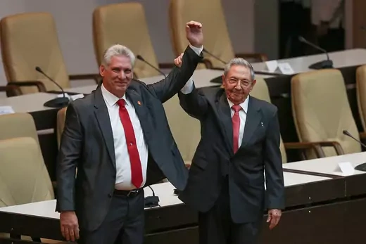Former Cuban President Raul Castro celebrates with newly elected President Miguel Diaz-Canel.