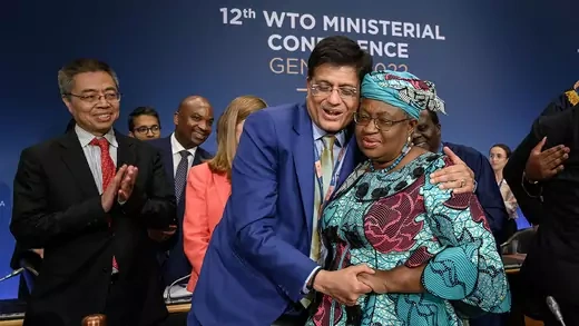 WTO Director-General Ngozi Okonjo-Iweala (right) is congratulated by Indian Commerce Minister Piyush Goyal after a closing session of a WTO Ministerial Conference in Geneva in June 2022.