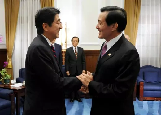 Taiwan President Ma Ying-jeou (R) greets former Japan prime minister Shinzo Abe at the presidential office in Taipei October 31, 2010