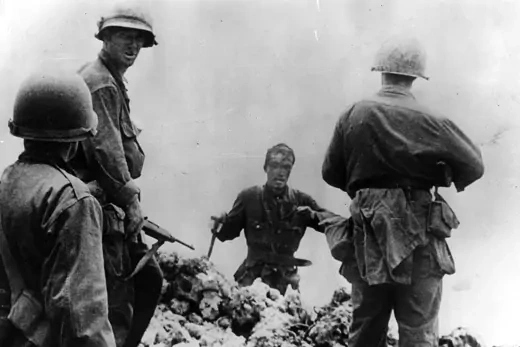 A Japanese officer surrenders to U.S. armed forces.