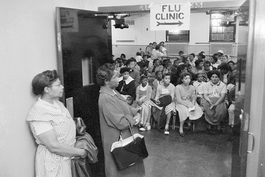 People who fear they have contracted the Asian Flu wait at a health clinic in New York City’s Harlem neighborhood in October 1957.