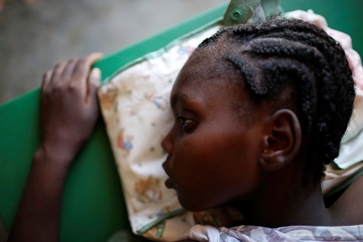 A girl receives treatment for cholera at a hospital in Jeremie, Haiti, in October 2016.