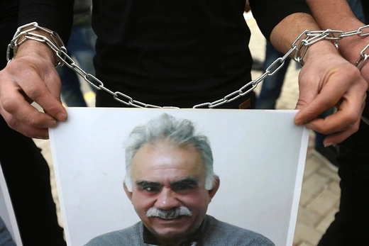 A Kurdish supporter of the PKK holds a portrait of jailed leader Abdullah Ocalan during a demonstration in Beirut, Lebanon, on February 15, 2015. 