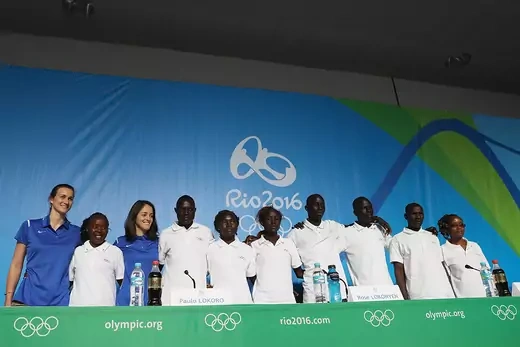 Members of the Refugee Olympic Team pose for a photo during a press conference.
