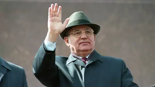 Soviet leader Mikhail Gorbachev, wearing a coat and hat, waves during the May 1 parade in Moscow’s Red Square in 1991.