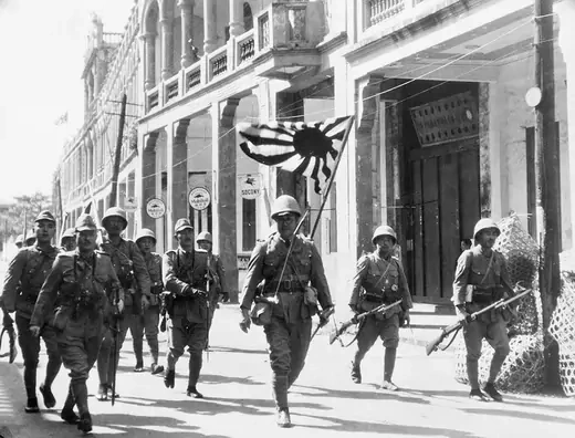 Japanese troops marching through Hainan Island in 1937.