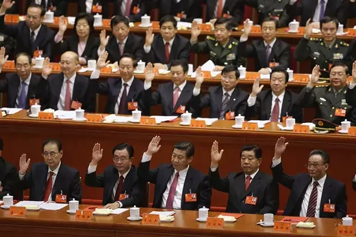 Delegates vote at the closing session of the 18th National Party Congress of China's Communist Party on November 14, 2012.