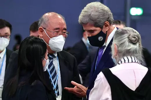 U.S. climate envoy John Kerry speaks with his Chinese counterpart, Xie Zhenhua.