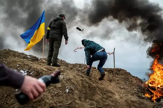 A civilian trains to throw Molotov cocktails, as Russia's invasion of Ukraine continues