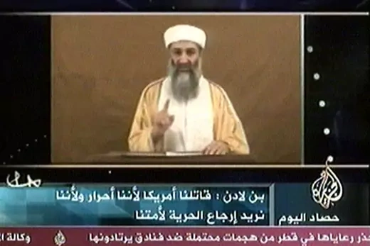 Osama bin Laden appearing on TV screen.