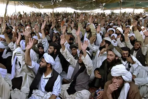 Pro-Taliban supporters shout slogans during a rally in Killi Nalai village.