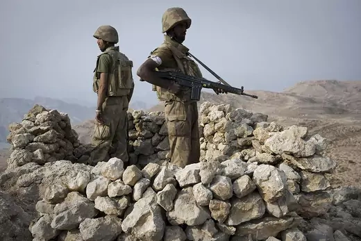 Pakistani soldiers secure an area on top of Kund mountain near Kotkai village in South Waziristan 