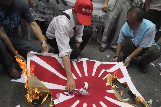 Activists in Taipei burn a flag symbolizing Japan during a protest over the Chinese fishing boat captain's detainment. 
