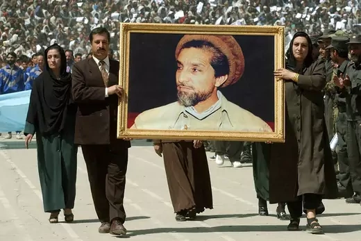 Afghans carry a picture of Massoud in Kabul.