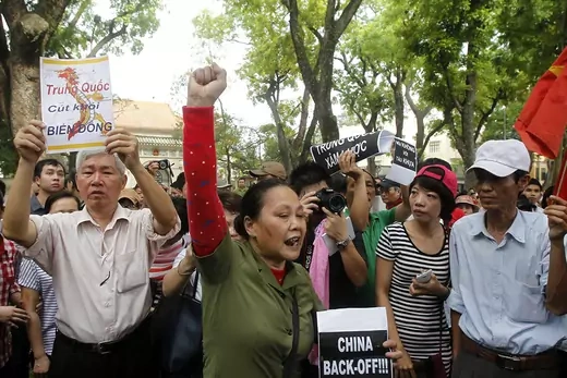 People protest against China's actions outside of the Chinese embassy in Hanoi, Vietnam. 