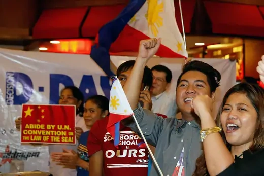Activists who travelled to disputed Scarborough Shoal and were blocked by Chinese Coastguard a few months ago, react after a ruling on the disputed South China Sea by an arbitration court in The Hague, Manila, Philippines, July 12, 2016. 