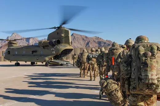 U.S. troops walk toward a helicopter in Afghanistan. 