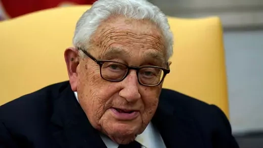 Former U.S. Secretary of State Henry Kissinger looks up during his meeting with U.S. President Donald Trump in the Oval Office of the White House in Washington, U.S., October 10, 2017.