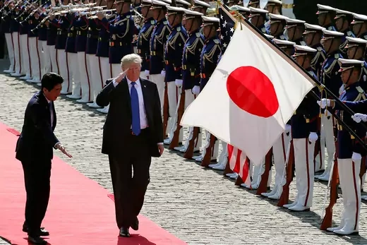 Trump is welcomed to Tokyo by Japanese Prime Minister Shinzo Abe.