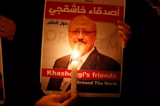 A demonstrator holds a poster of journalist Jamal Khashoggi outside the Saudi consulate in Istanbul.