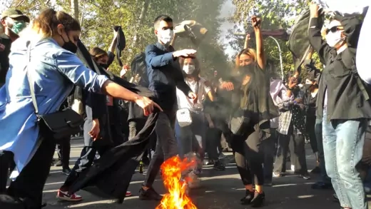 Iranian protestors burning headscarfs