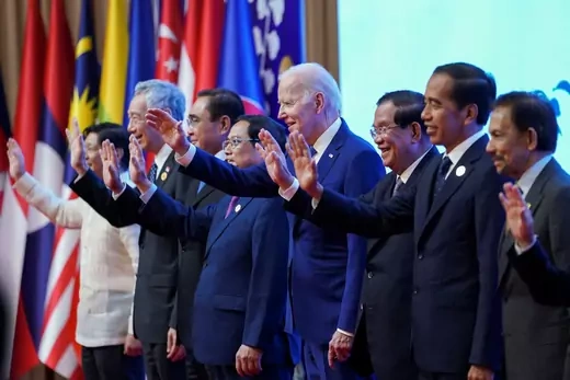 Biden and ASEAN leaders stand in a line waving