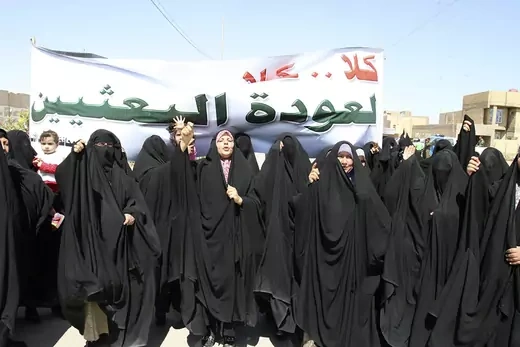 Women chant slogans as they demonstrate against Baath party in Najaf.