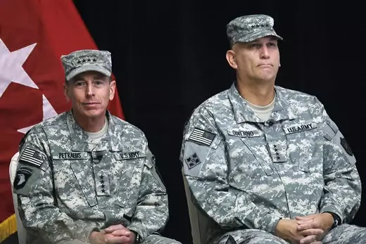 General David Petraeus (L) sits beside General Ray Odierno during a Change of Command ceremony at Camp Victory in Baghdad.