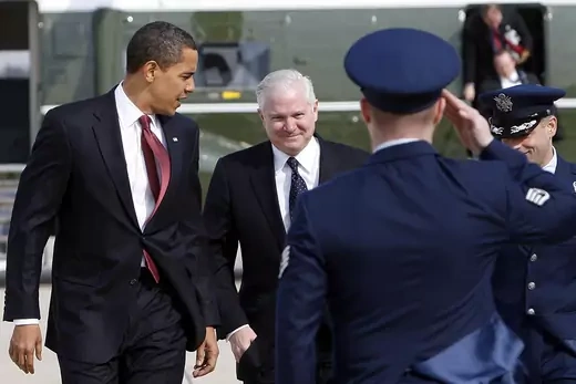 U.S. President Barack Obama and Secretary of Defense Robert Gates step off Marine One to board Air Force One.